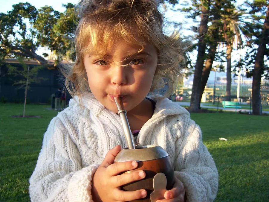 Flor at age 3, drinking mate